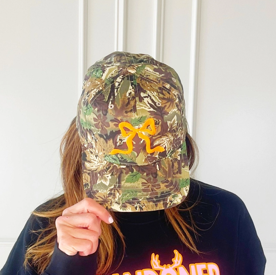 Camo Trucker Hat w/ Embroidered Orange Bow